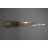 A Chinese silver gilt and celadon jade mounted letter knife, with carved and pierced decoration to