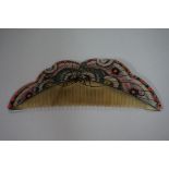 A Chinese carved and painted horn 'butterfly' hair comb, five character mark in gilt, 13.5cm wide.