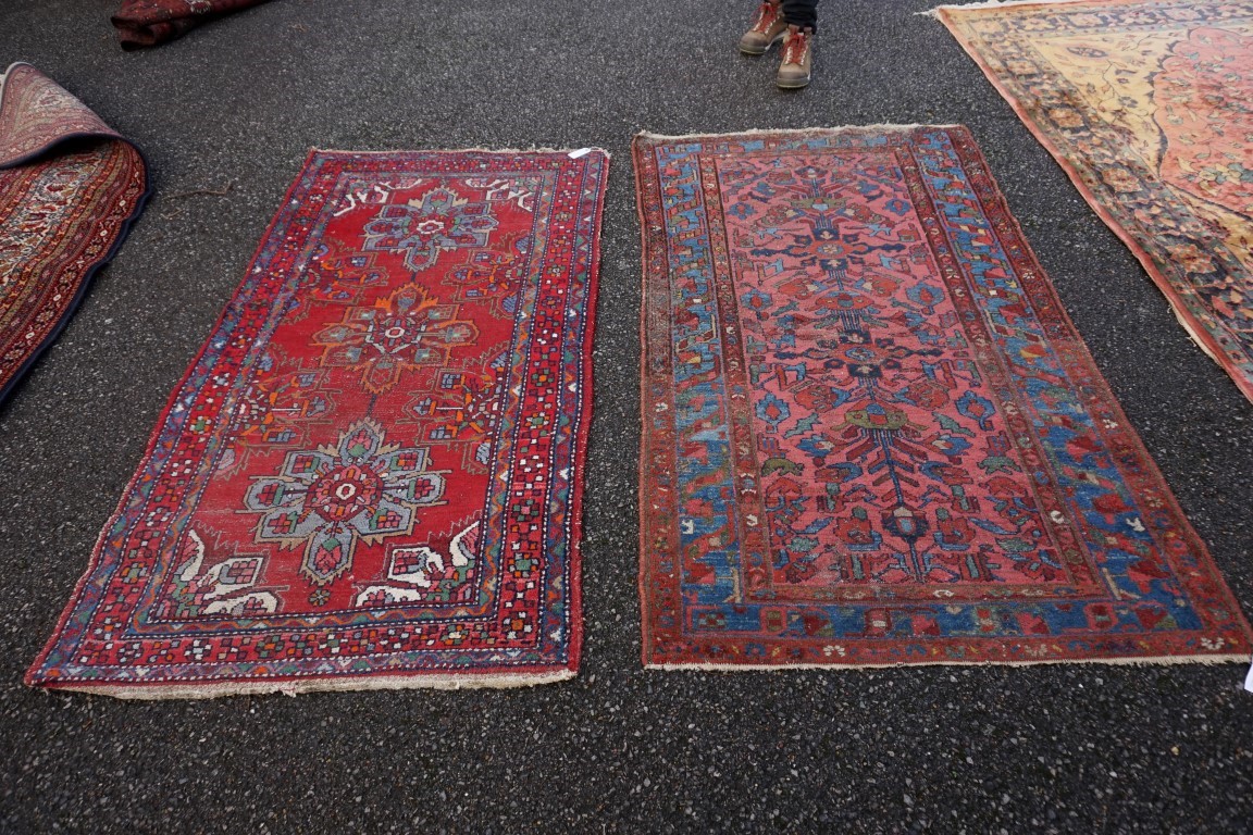 A Persian rug, having geometric borders, 186 x 103cm; together with another Persian rug.