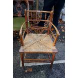 An antique beech and rush seated Sussex chair. This lot can only be collected on Saturday 19th