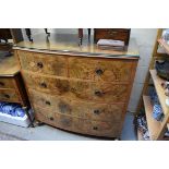 A 1930s figured walnut part bedroom suite, comprising: a bowfront chest of drawers, 106.5cm wide;
