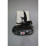 A bronze figure of Pegasus, 16.5cm high, on green marble stand.