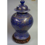 A large Chinese blue and gilt inverted baluster vase and cover, Kangxi six character mark to base,