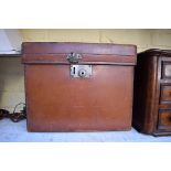 A leather cased morning hat, the case inscribed 'Harrod Ltd'.