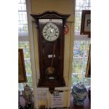 A walnut Vienna style wall clock, with Lenzkirch power maintaining movement, 108cm high, with