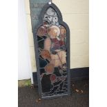 A large Victorian stained and leaded glass panel, depicting Jesus and Apostles, in ebonized frame,