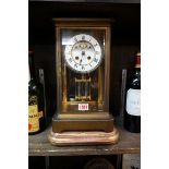 A late 19th century gilt brass four glass mantel clock, 33cm high, with mercury pendulum and winding