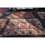 A Persian rug, having geometric borders, 198 x 140cm; together with one other rug having floral
