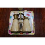 A pair of Victorian ivory and gilt brass opera glasses, by 'S & B Solomons, London', 13.5cm extended