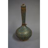 A Kashmiri enamel bottle vase and cover, 19th century, decorated with stylized leaves, 24.5cm high.