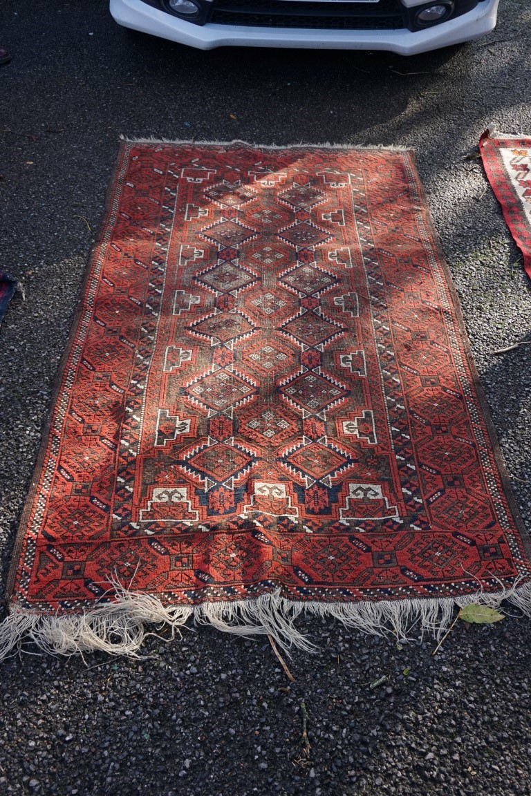 A Bokhara rug, having repeated central field with geometric borders, 182 x 110cm.