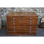 (THH) A vintage oak plan chest having six drawers.This lot can only be collected on Saturday 19th