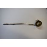 An antique silver toddy ladle having baleen handle.