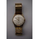 A 1950s Vertex 'Review' 9ct gold manual wind wristwatch, 33mm, on later expanding bracelet.