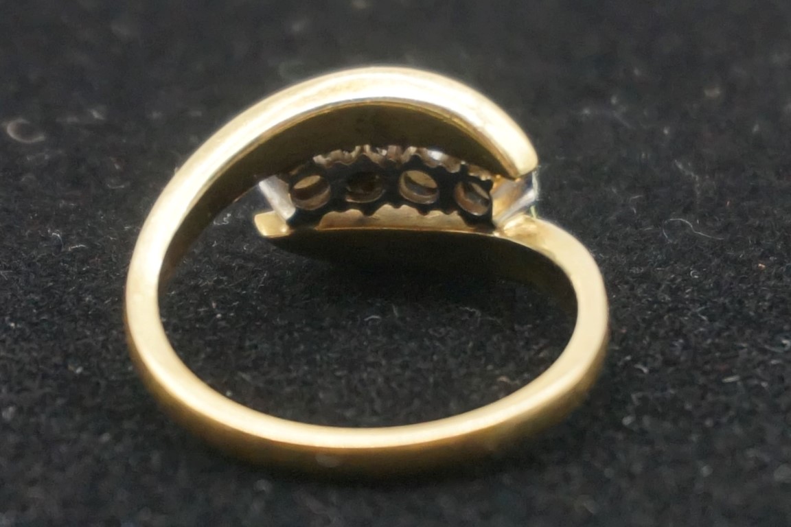 A diamond gold twist ring, hallmarked 750, set four diamonds of approximately 0.5ct, 5.2g gross - Image 3 of 3