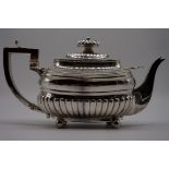 A George III silver teapot, by J W Story & W Elliott, London 1810, 13cm high, 756g gross weight.