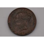Coins: a Victoria 1855 penny, young head.