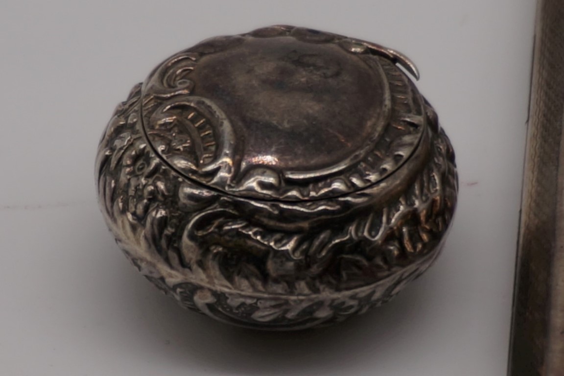 A silver embossed pill box, by L&S, Birmingham 1888, 32mm diameter; together with an engine turned - Image 2 of 4