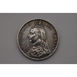 Coins: a Victoria 1887 half crown.