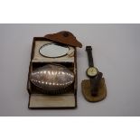 A vintage Waltham silver wristwatch; together with a cased silver backed brush.