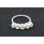 A five stone diamond ring, stamped plat, set old mine cut diamonds of approximately 1.3ct.