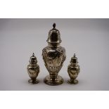 A pair of Edwardian silver pepperettes, by Walker & Hall, Sheffield 1902, 83g; together with a