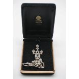 An antique rose cut diamond white metal pendant, having later collet set sapphires, 7cm long;