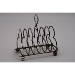 (THH) A Victorian silver six section trefoil toast rack, by Hukin & Heath, London 1896, 15cm wide,