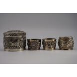 An Indian white metal pot and cover; together with three other similar items. (4)