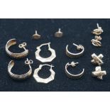 Six pairs of yellow metal earrings and ear studs.