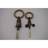 Two silver and mother of pearl novelty teething rattles, comprising a silver gilt owl dated