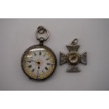 A Continental embossed .935 silver fob watch, having decorated enamel dial, 30mm; together with a