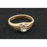 A solitaire diamond gold ring, stamped 18, the old mine cut stone approximately 0.5ct.