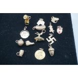 Eleven various gold charms, hallmarked 9ct, 11g; together with three unmarked examples. (14)