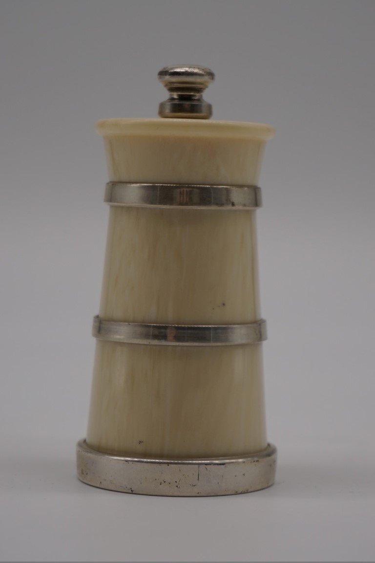 A faux ivory and silver banded pepper grinder, by John Bull Ltd, London 2002, 9.5cm high.