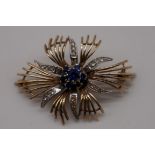 A gold floral spray brooch, hallmarked 375, 5cm across, 12g gross weight, (a.