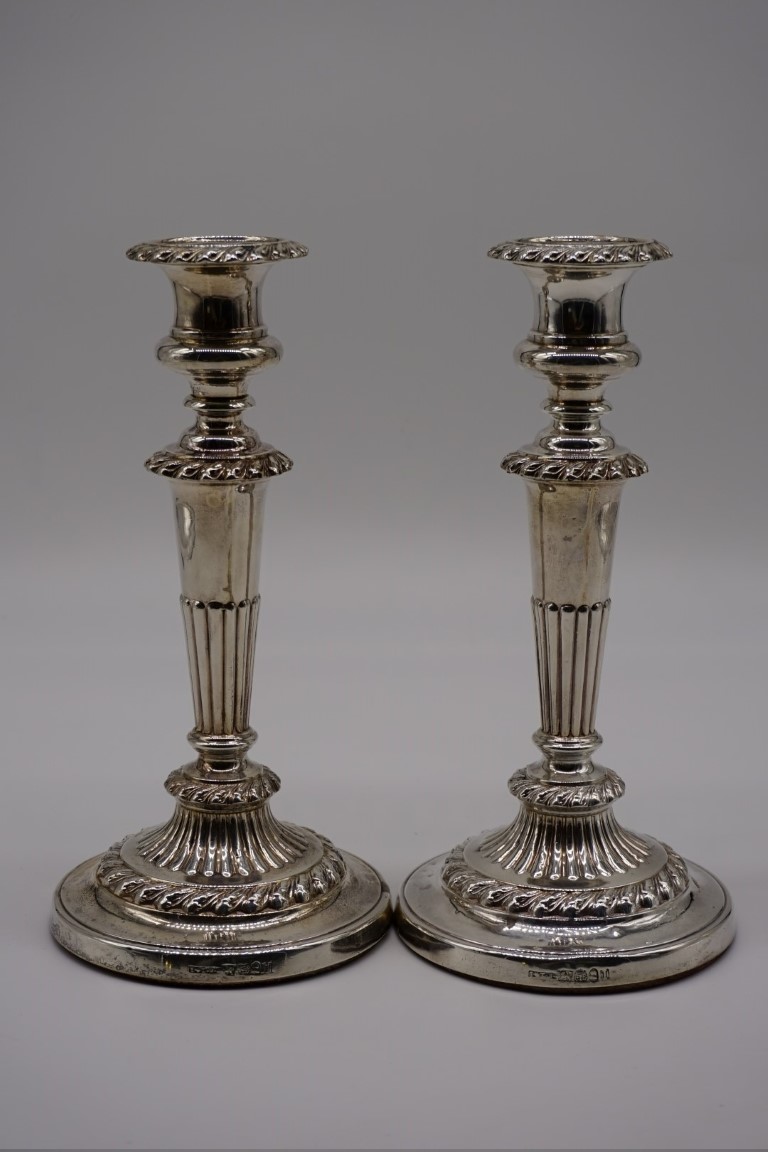 A pair of George III silver candlesticks, by John & Thomas Settle, Sheffield 1818, 23cm high.