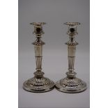 A pair of George III silver candlesticks, by John & Thomas Settle, Sheffield 1818, 23cm high.