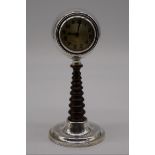A silver and turned wood desk clock, by Charles Perry & Co. Chester 1911, 20cm high.