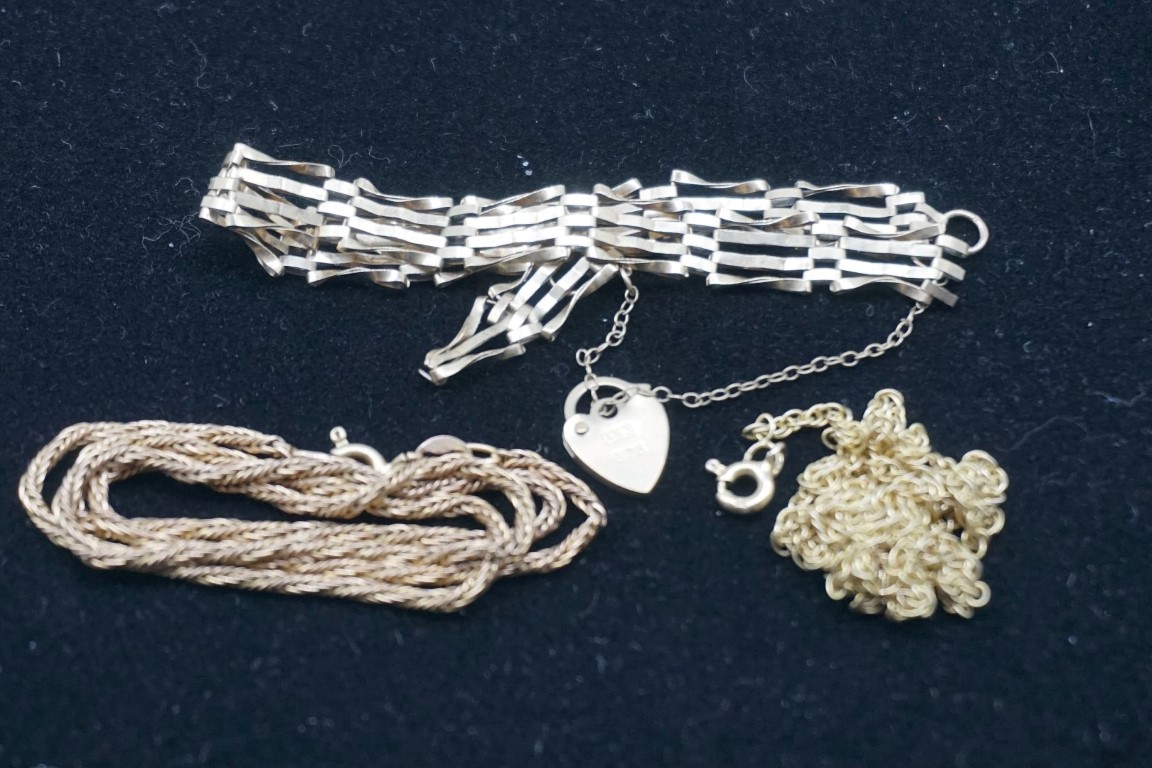 Two gold neck chains; together with a gold bracelet, (a.f.), all stamped or hallmarked 375/9k, 11.