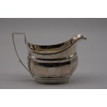 A George III silver gilt lined milk jug, partial makers mark, London 1802, having bright cut