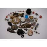 A quantity of Victorian and later jewellery, to include a floral glass necklace and various carved