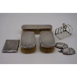 (THH) A small quantity of silver and silver mounted items, to include: a silver four section toast