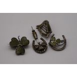 Two moss agate silver 'shamrock' brooches; together with a similar Irish harp example; and a