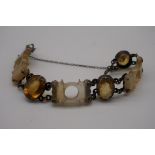 A Victorian oval citrine and carved agate bracelet.