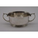 A silver twin handled sugar basin, by Harrods Ltd, Birmingham 1937, 14.5cm diameter, 226g.