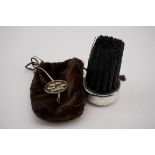 An American sterling silver mounted hat brush, by Gorham, 6cm diameter, in a velvet travel bag.