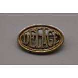 Automobilia: an oval 'Delage' gold badge, hallmarked 750, 5.1g.