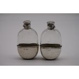 (THH) A pair of Victorian silver mounted glass hip flasks, by Thomas Johnson II, London 1883, 13.5cm