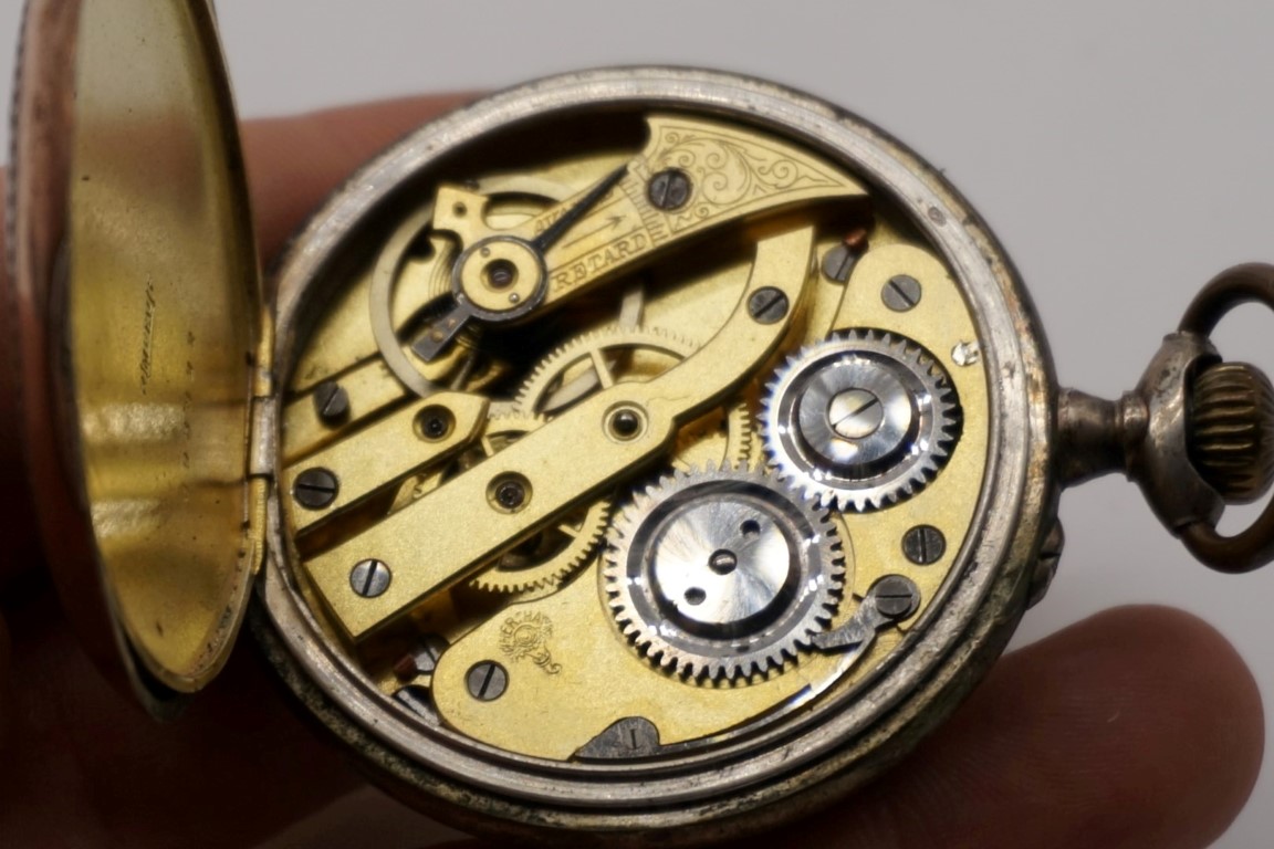 An early 20th century Hertha .800 open faced stem wind pocket watch, 47mm. - Image 6 of 6